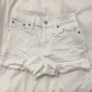 Levi’s high rise frayed hem white denim shorts